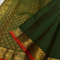 Close view of repeated elephant motifs framed within ornamental classic-gold zari border panels.