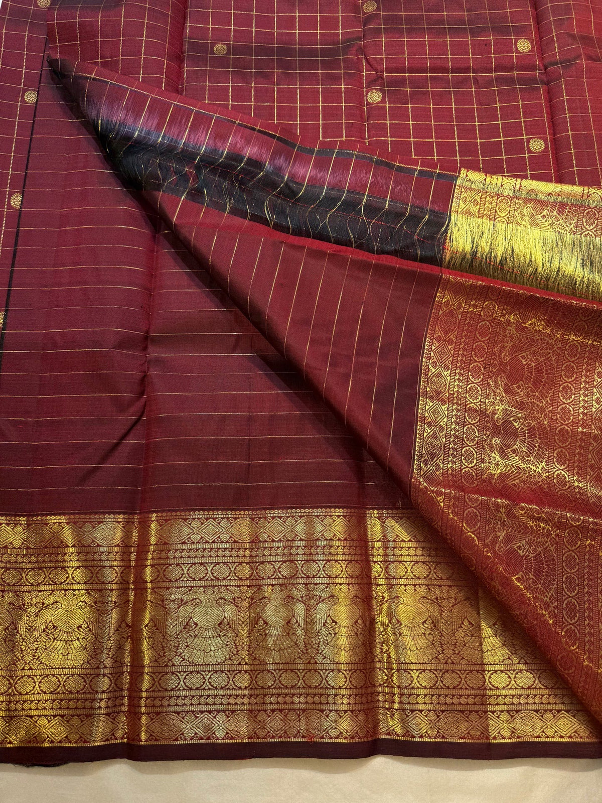 Gandaberunda gold zari border on maroon Zari Kattam saree
