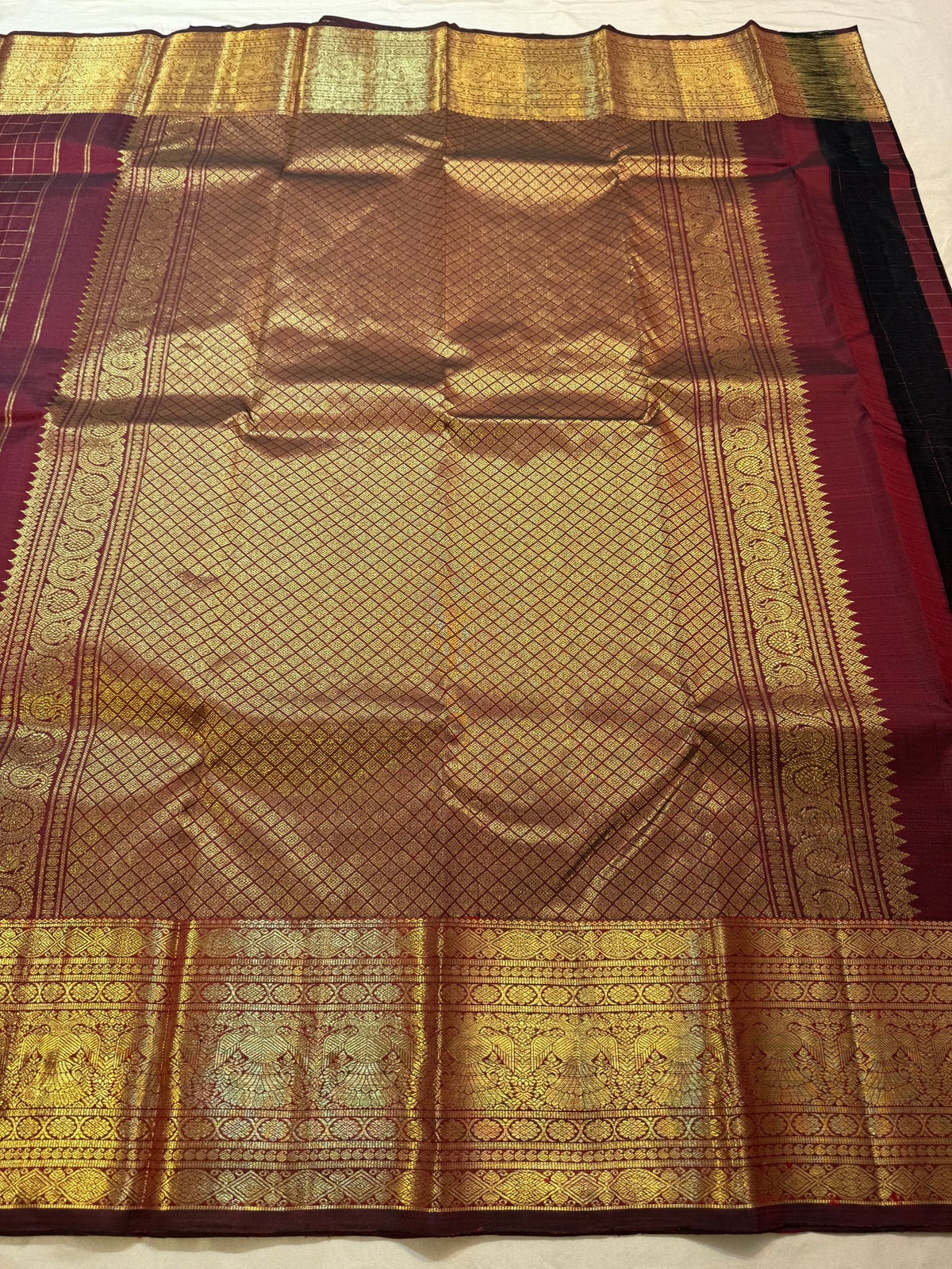 Ornate Kamalam butta detail on maroon pure silk