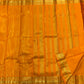 Close view of fine continuous Vairaoosi zari lines on Saffron Orange silk.