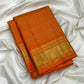 Broad floral gold zari border on Saffron Orange Zari Kattam silk saree.