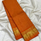 Close view of gold zari grid on Deep Saffron Orange pure silk Kanchipuram saree.