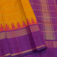 Warm saffron-orange Kanchipuram silk with fine spaced horizontal gold zari lines.