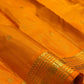 Saffron Orange pure silk Kanchipuram Vairaoosi saree with fine directional zari lines.