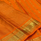 Saffron Orange Kanchipuram silk woven with fine intersecting gold Zari Kattam checks.