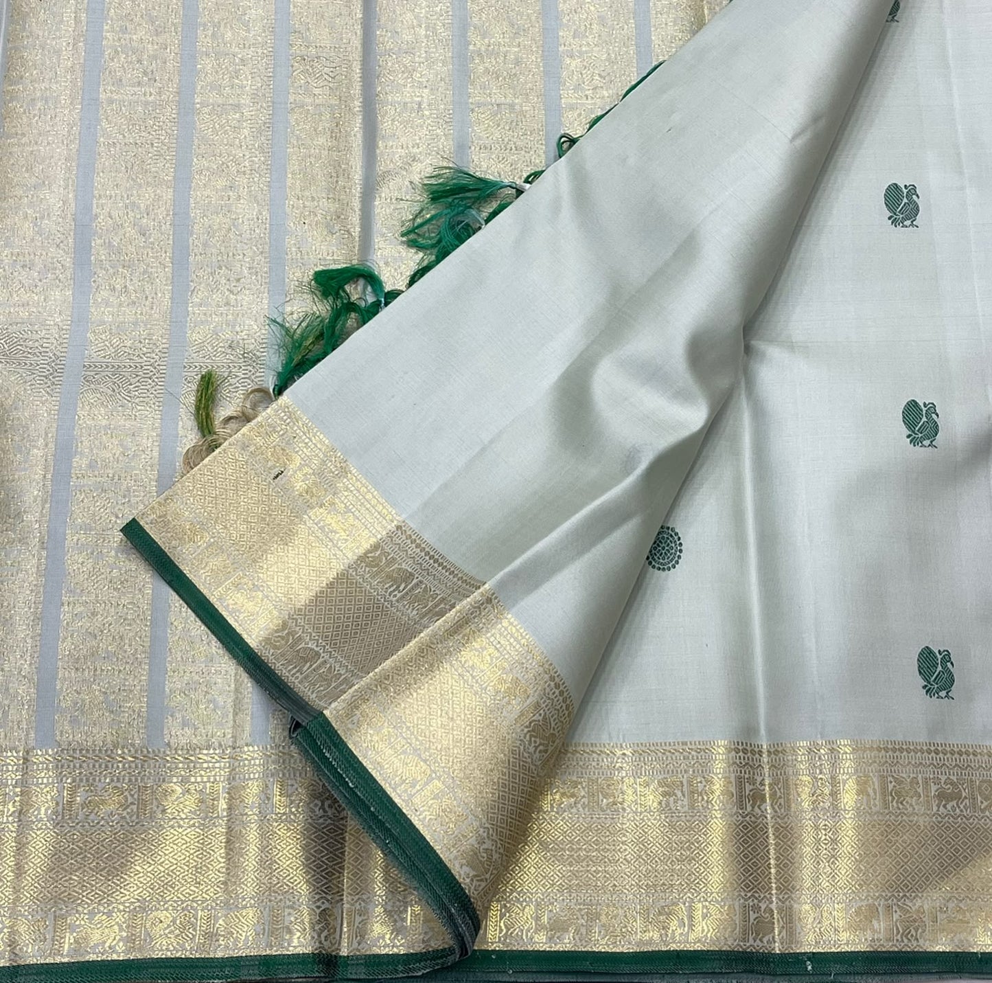 Sage green body close-up showing dark green butta motifs