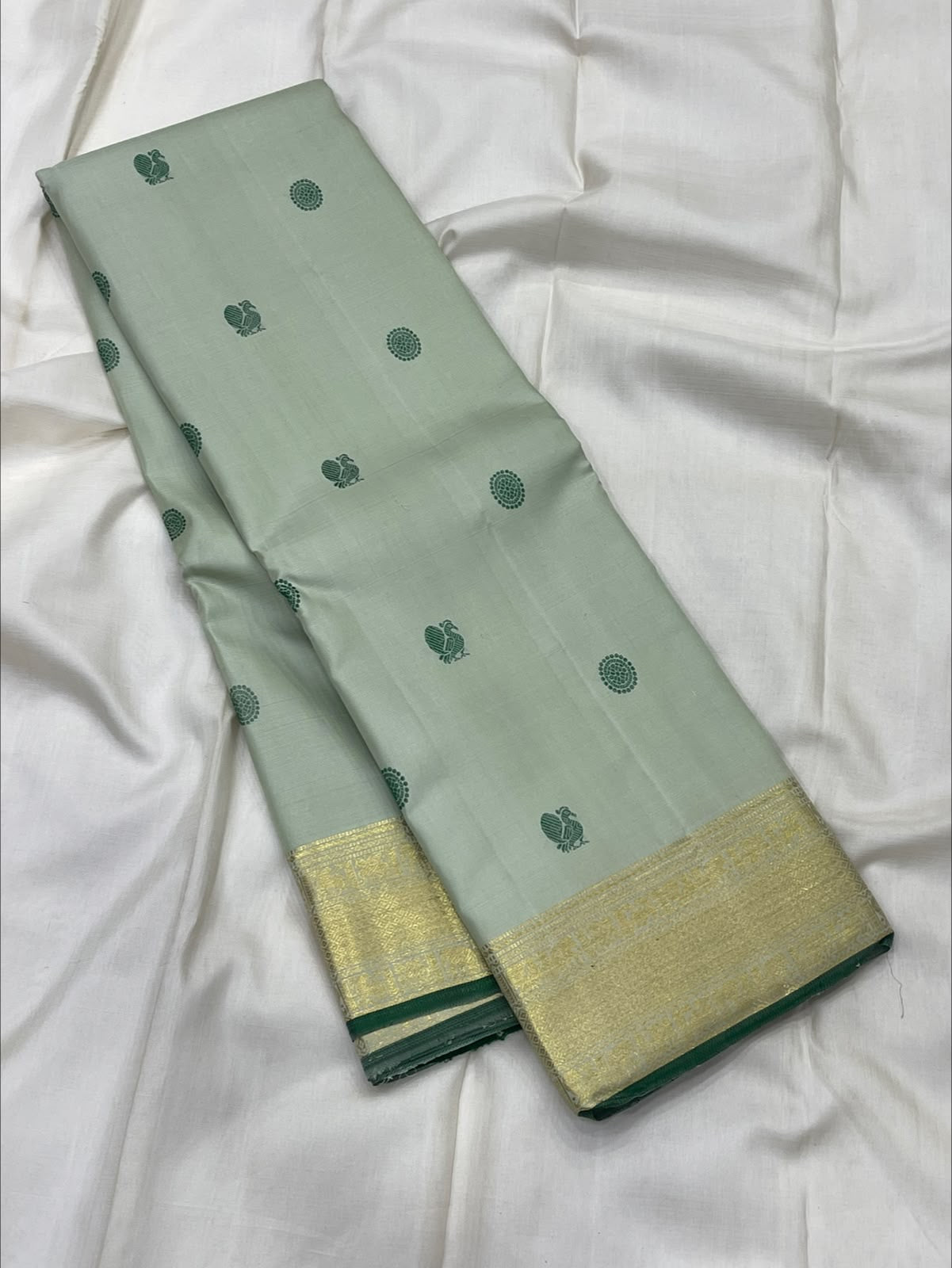 Sage green 2gm zari Kanjivaram saree folded, full view