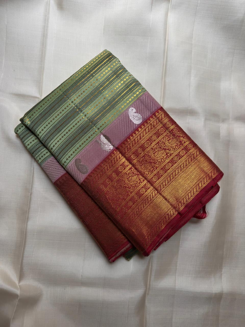 Maroon border detail on sage green Kanchi Pattu silk saree