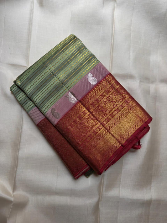 Maroon border detail on sage green Kanchi Pattu silk saree