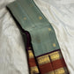 Full view of sage green handwoven Kanchipuram pure silk saree with korvai rettapet border — Idam Living