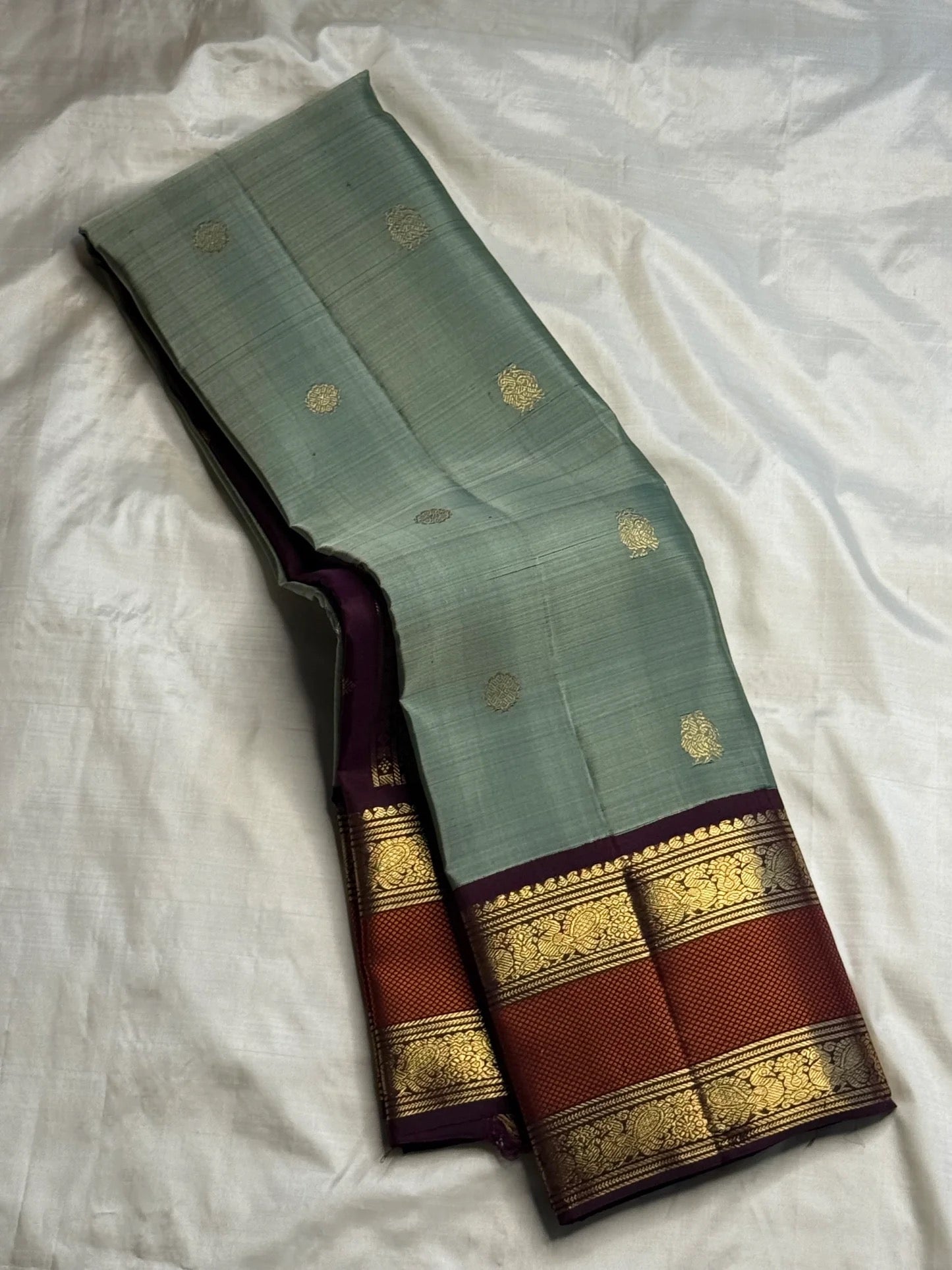 Full view of sage green handwoven Kanchipuram pure silk saree with korvai rettapet border — Idam Living