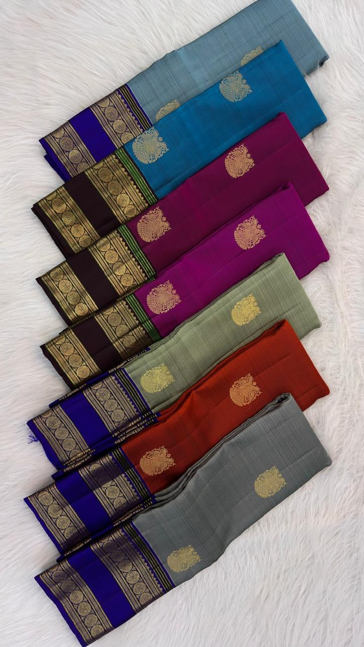 Handwoven sage green Kanchipuram saree with Gandaberunda zari buttas throughout.