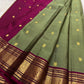 Sage green Kanchipuram silk saree with traditional gold zari border detail