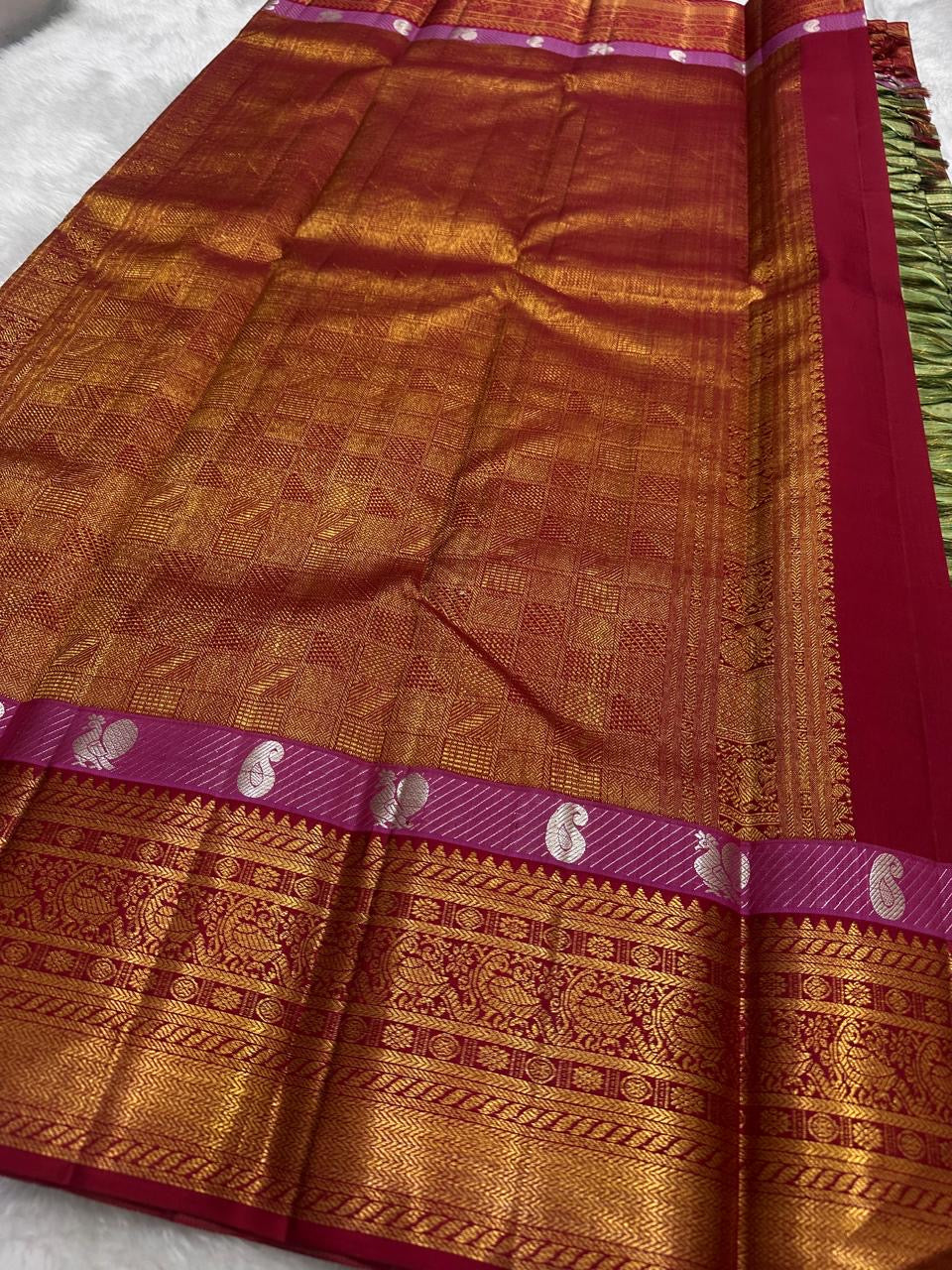 Gold zari detail on sage green Kanchi Pattu silk saree