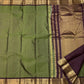 Sage green Kanjeevaram silk saree with traditional plum border and gold zari pallu — Idam Living