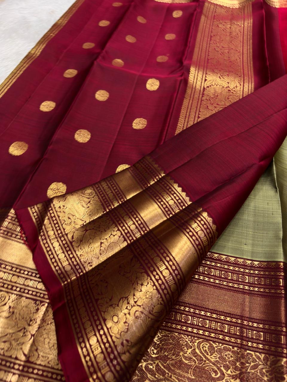 Rich deep red Vanasringaram gold zari pallu of sage green Kanjipuram pure silk saree