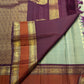 Mayil chakram butta in gold zari close-up on sage green Kanjipuram pure silk saree — Idam Living