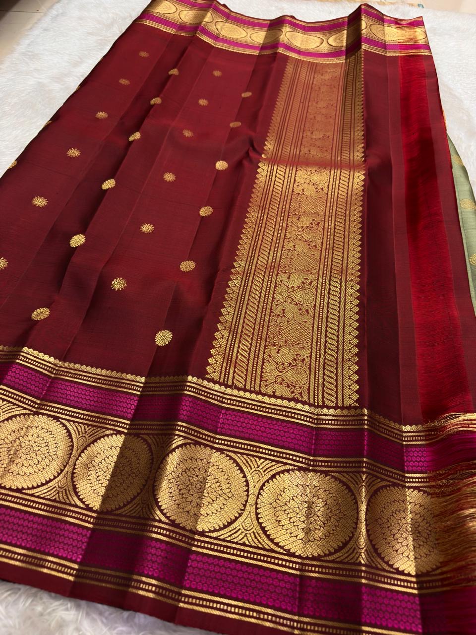 maroon border detail of sage green Kanchipuram silk saree