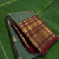 Sage green Korvai Kanjivaram silk saree with burgundy red border and yaanai ambari butta – front drape view