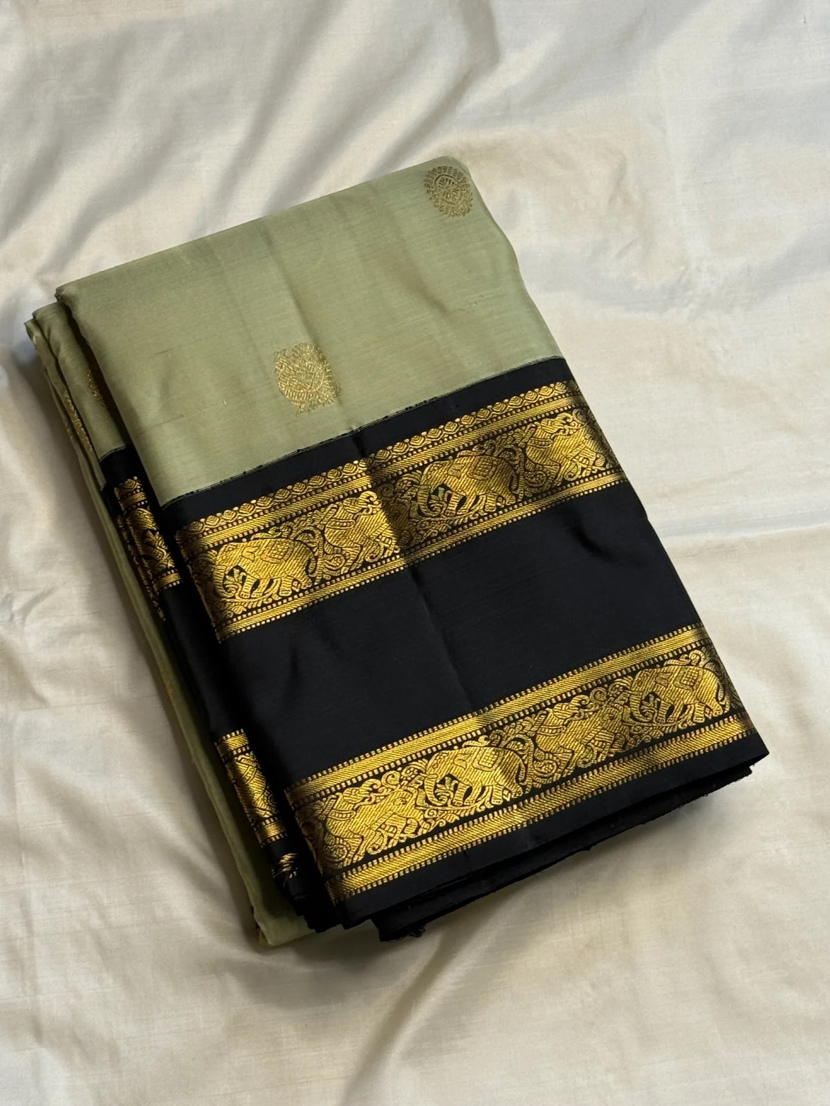 Sage green handwoven pure silk Rettapet Kanchipuram saree with ink blue border