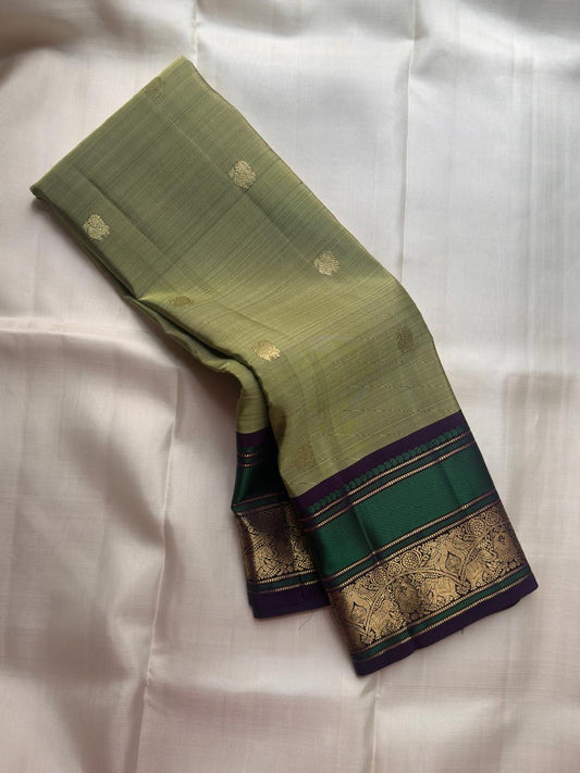 Sage olive green pure silk KanchiPattu saree with gold zari Butta motifs, full drape view