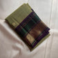 Close-up of antique gold zari Butta motifs on sage olive green KanchiPattu silk saree
