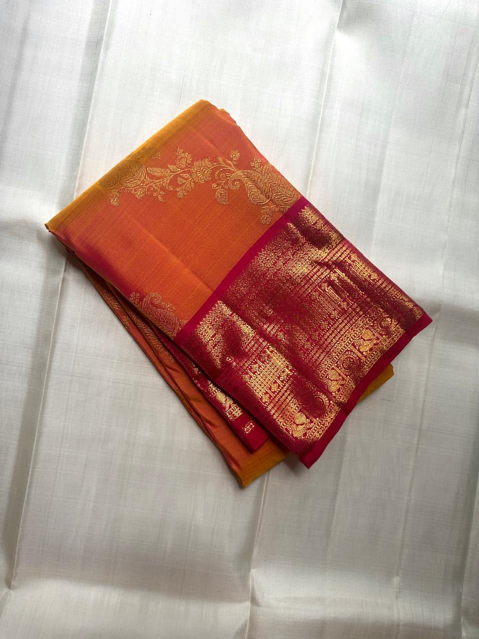 Sampangi Gold Kanchipuram Butta saree with Rani Pink gold-zari border.