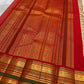 Deep red and forest green Varisaipet border with elephant procession and floral zari medallions