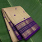 Sandal beige Kanjivaram silk saree with regal violet korvai border – front view