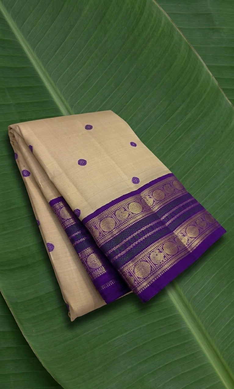 Sandal beige Kanjivaram silk saree with regal violet korvai border – front view