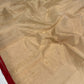 Sandalwood beige handloom Chanderi silk saree showing delicate gold buttas and slender deep red border