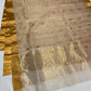 Sandalwood Beige Katan Silk Chanderi saree laid flat showing petite gold buttas and clean gold border.