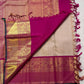Folded view of a Sandalwood Beige and Deep Magenta Pure Silk Korvai Kanchipuram saree with alternating pink and green silk-thread buttas and golden paisley motifs