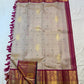 Close folded view of the Sandalwood Beige body and broad Deep Magenta zari border with elephant panels