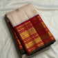 Sandalwood Ivory Korvai saree with narrow green selvedge detail.