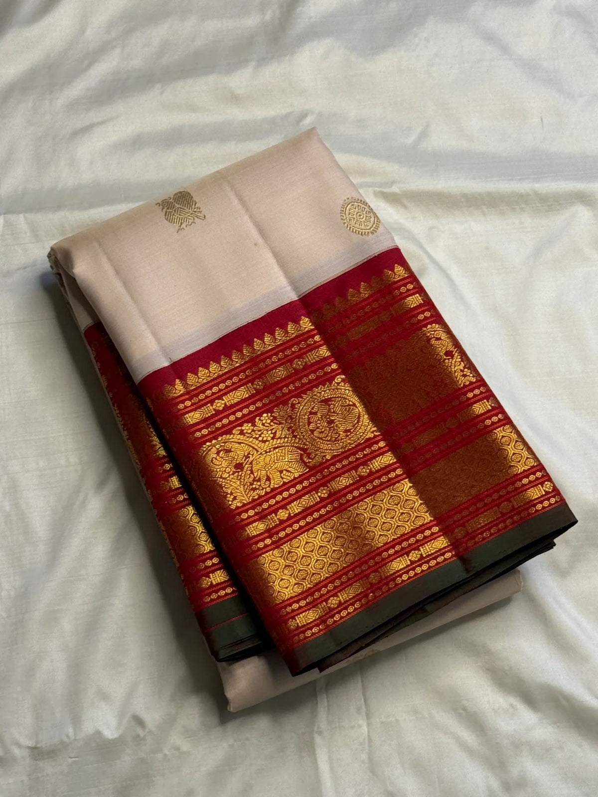 Sandalwood Ivory Korvai saree with narrow green selvedge detail.