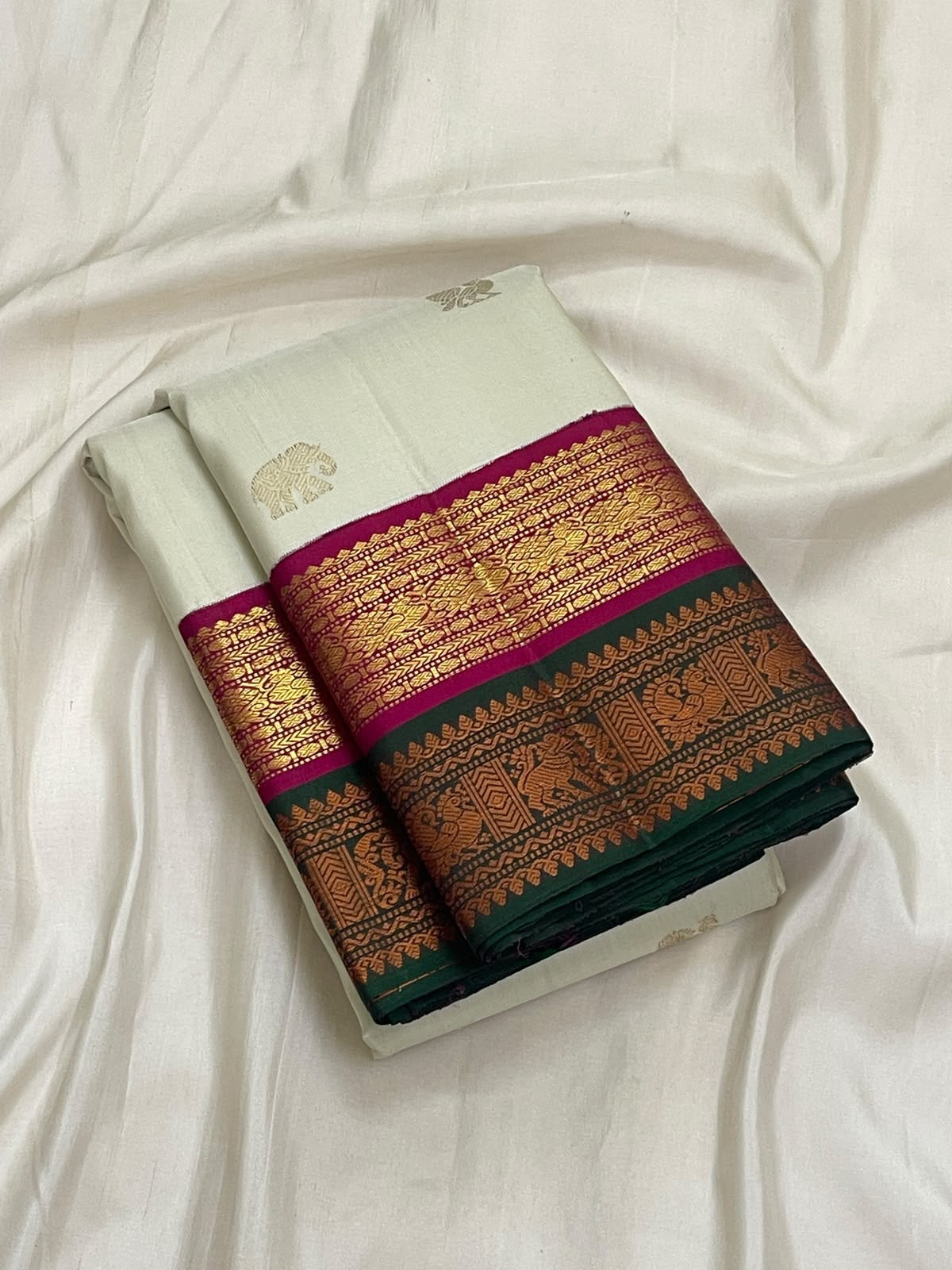 Sandalwood Ivory Handwoven Pure Silk Kanjivaram Korvai Saree with Peacock and Elephant Motifs, decorative pallu detail