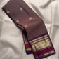 Muted Taupe Brown Pure Silk Kanchipuram Butta saree with a sandalwood-toned body.