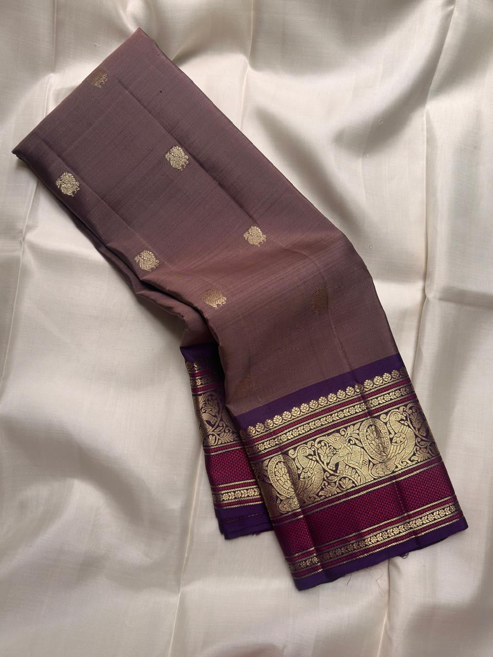 Muted Taupe Brown Pure Silk Kanchipuram Butta saree with a sandalwood-toned body.