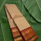Sandstone beige handwoven Kanchipuram pure silk saree with kamalam butta and korvai border on banana leaf — Idam Living