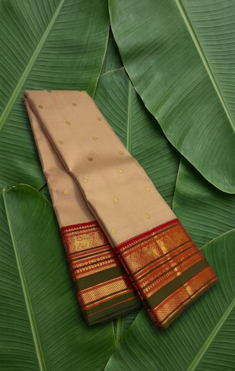 Sandstone beige handwoven Kanchipuram pure silk saree with kamalam butta and korvai border on banana leaf — Idam Living