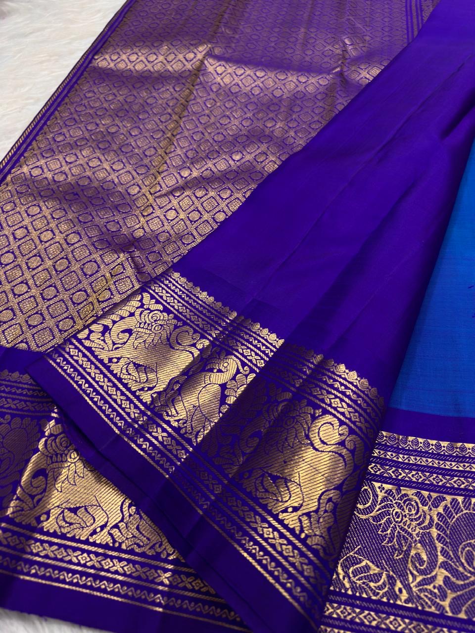 Sapphire Blue Handwoven Pure Silk Kanchi Pattu Butta Saree with Vadamalli Gold Zari Border