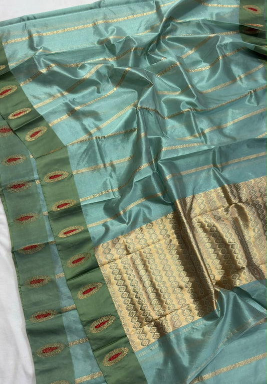 Sea glass blue handloom Pattu Silk Chanderi saree with fine gold zari stripes and a sage green border