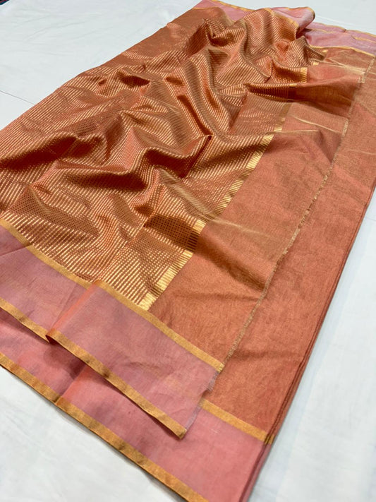 Handloom saree spread flat highlighting metallic border detailing