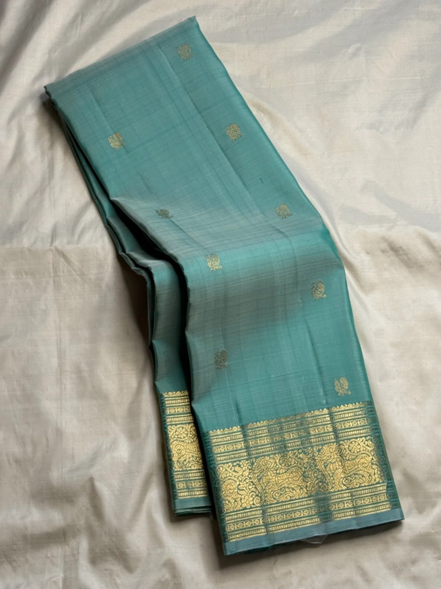 Sea Glass Aqua Handwoven Pure Silk Kanchi Pattu Saree with Antique Gold Zari Buttas and Ornamental Border