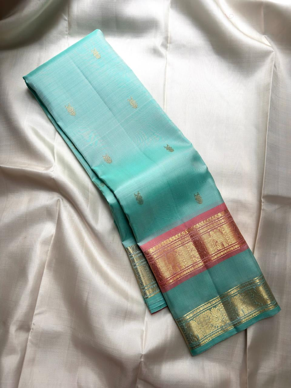 Sea-Glass Aqua Handwoven Pure Silk Kanchipuram Saree with Coral-Rose Rettapet Border and Gold Zari Buttas