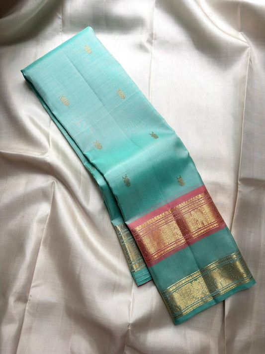 Sea-Glass Aqua Handwoven Pure Silk Kanchipuram Saree with Coral-Rose Rettapet Border and Gold Zari Buttas
