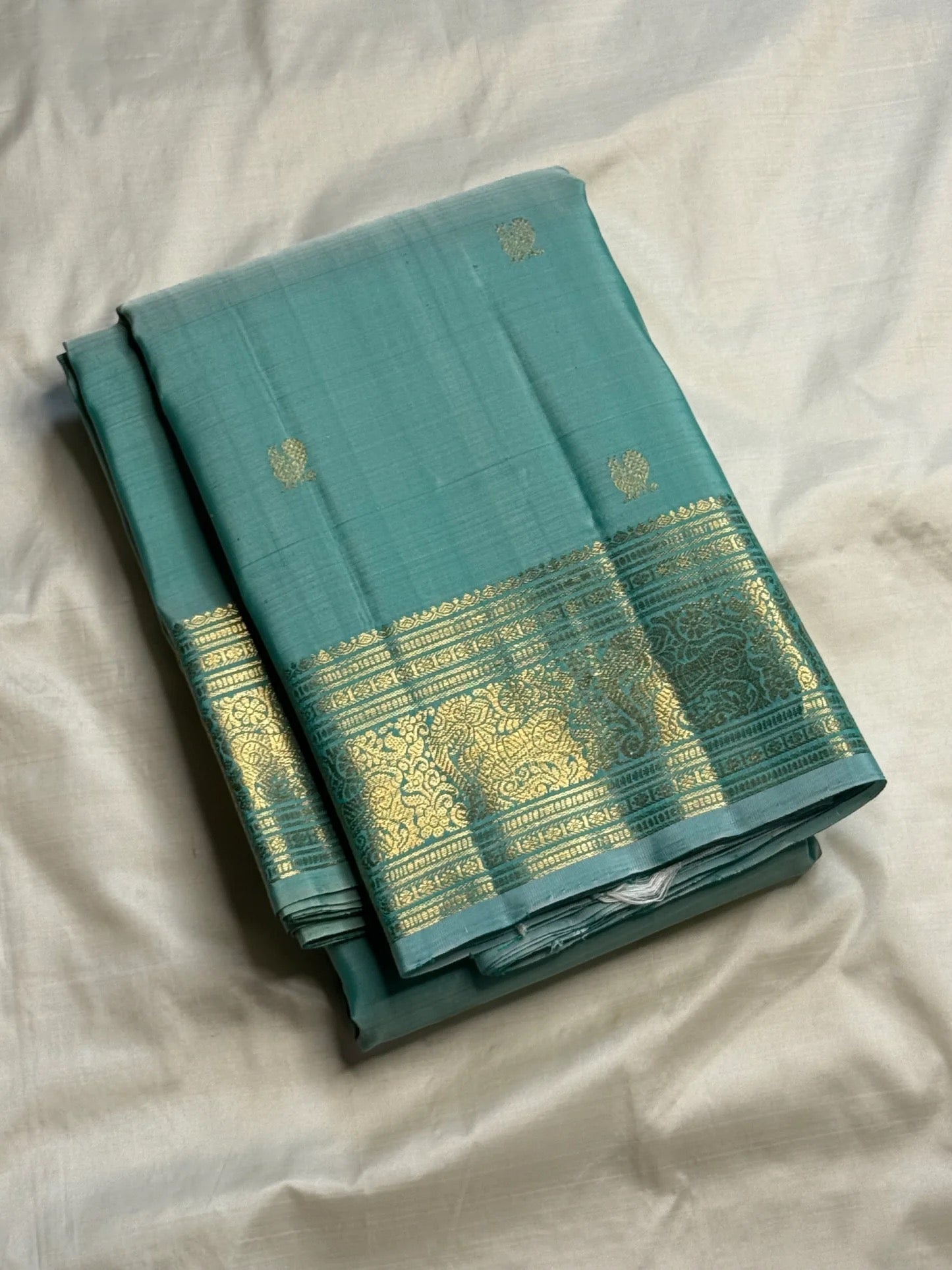 Sea Glass Aqua Handwoven Pure Silk Kanchi Pattu Saree with Antique Gold Zari Buttas and Ornamental Border