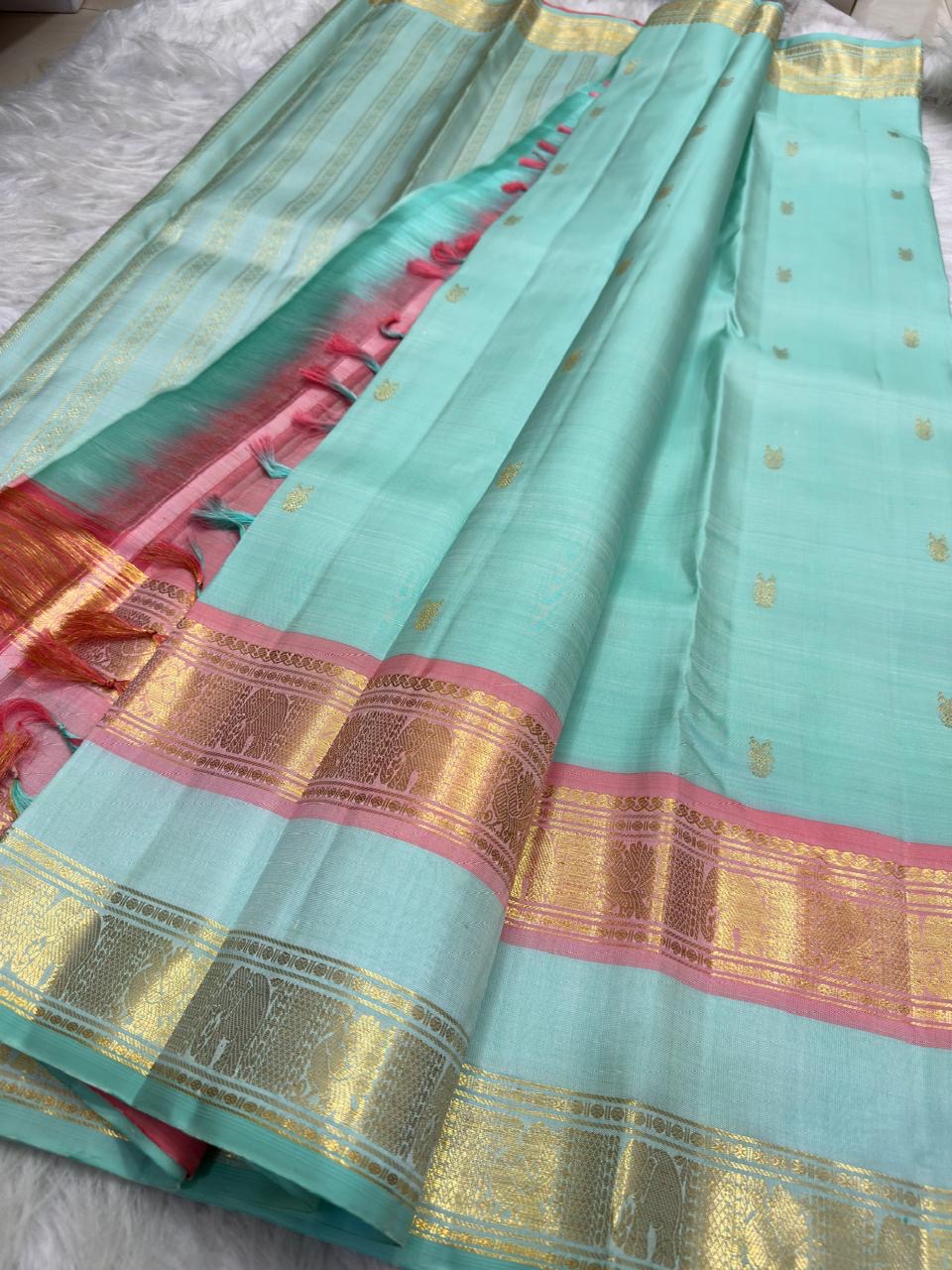 Sea-Glass Aqua Handwoven Pure Silk Kanchipuram Saree with Coral-Rose Rettapet Border and Gold Zari Buttas