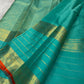 Close view of traditional antique-gold zari motifs woven on Sea Green Kanjivaram silk.